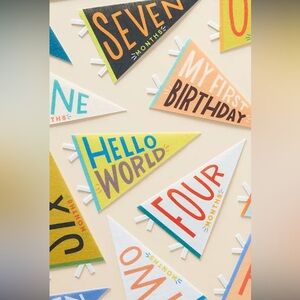 NWOT Monthly Milestone First Year Pendants from
ANTHROPOLOGIE